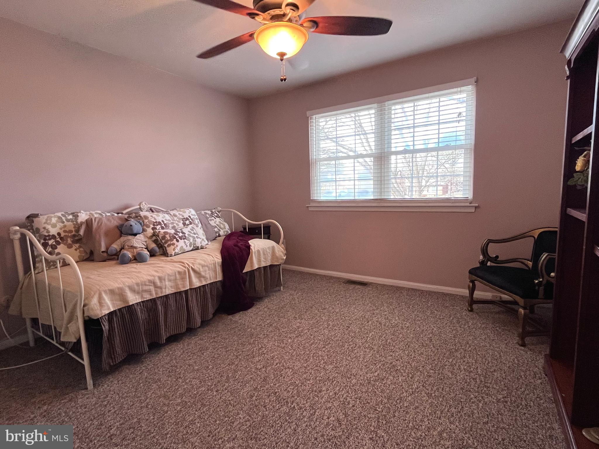 145 Joanne Road Holland, PA 18966 - Photo 40 of 54 a bedroom with a bed and a chandelier