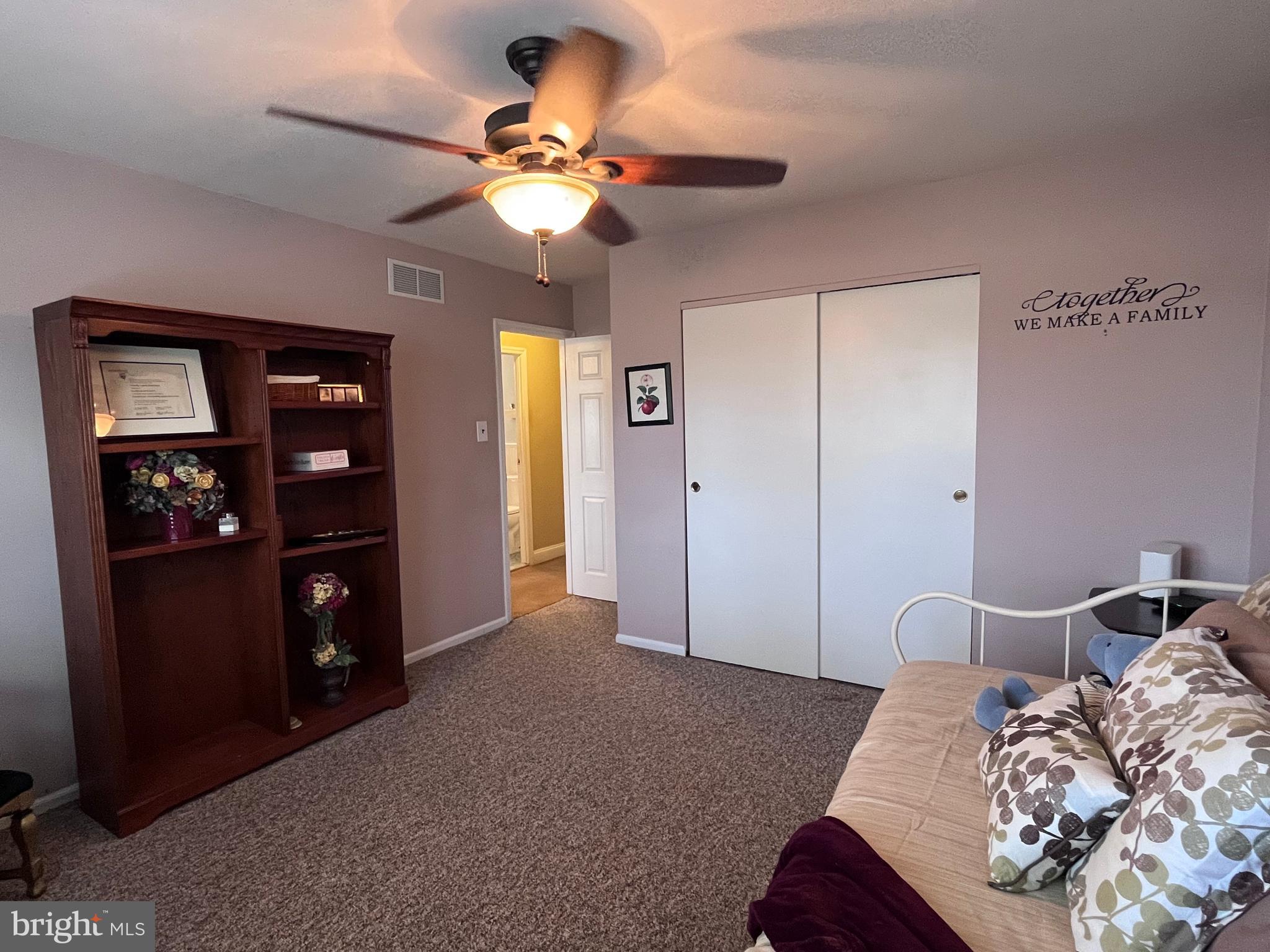 145 Joanne Road Holland, PA 18966 - Photo 41 of 54 a bedroom with a bed and a chandelier