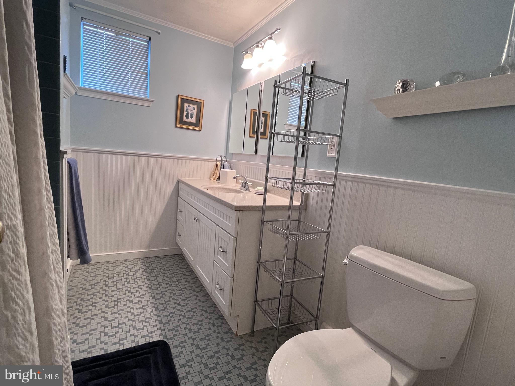 145 Joanne Road Holland, PA 18966 - Photo 48 of 54 a bathroom with a granite countertop toilet sink and mirror