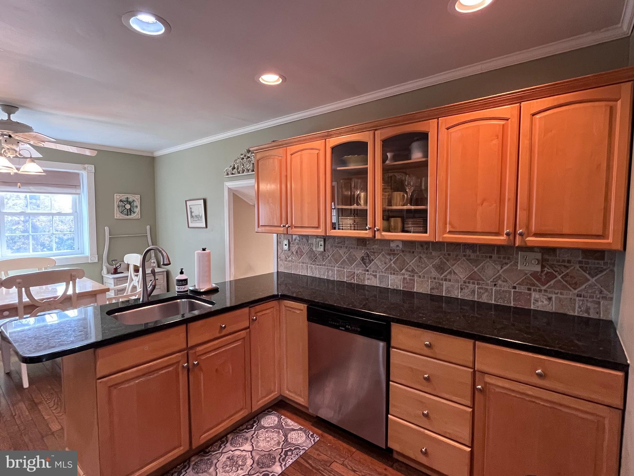 145 Joanne Road Holland, PA 18966 - Photo 5 of 54 a kitchen with granite countertop cabinets sink and window