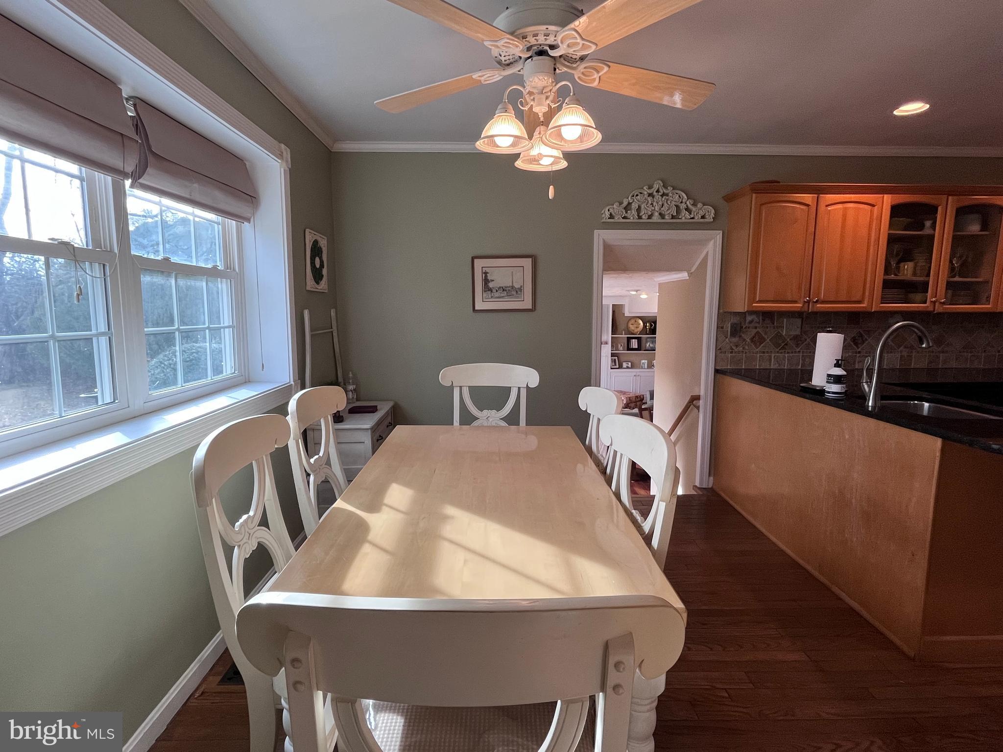 145 Joanne Road Holland, PA 18966 - Photo 7 of 54 a view of a dining room with furniture and chandelier