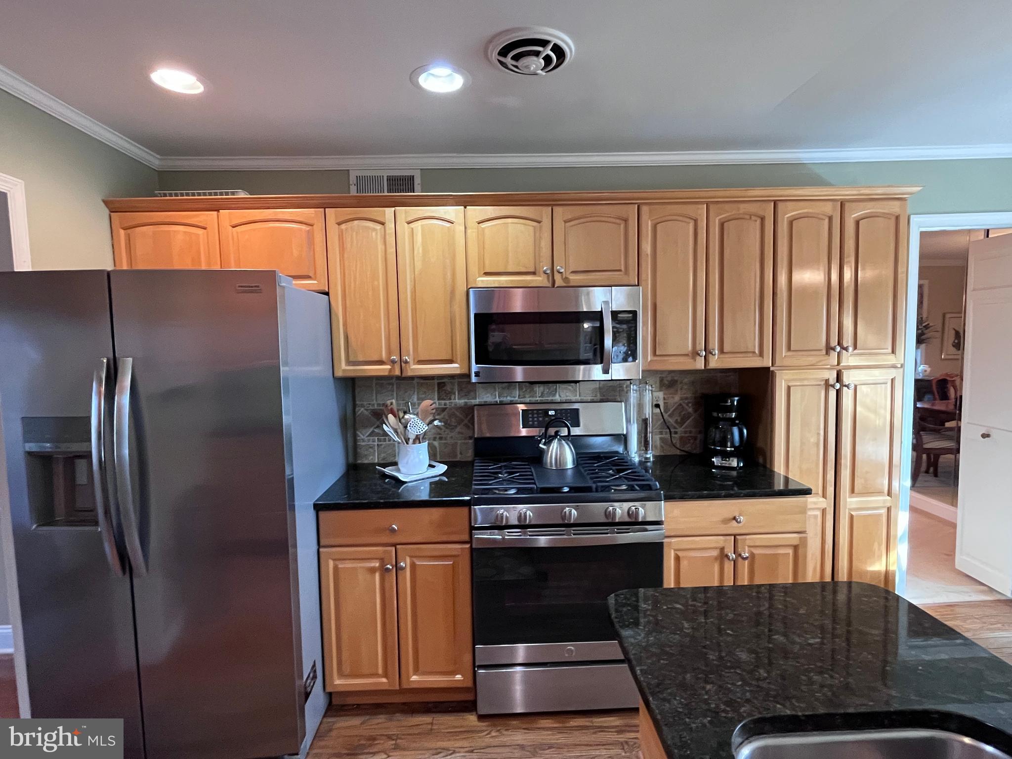 145 Joanne Road Holland, PA 18966 - Photo 9 of 54 a kitchen with stainless steel appliances granite countertop a refrigerator a stove top oven a sink and dishwasher