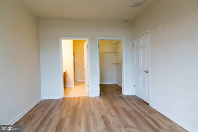 a view of wooden floor in an empty room