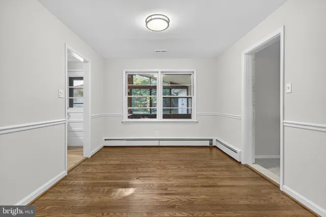 a kitchen with granite countertop a refrigerator stove and microwave