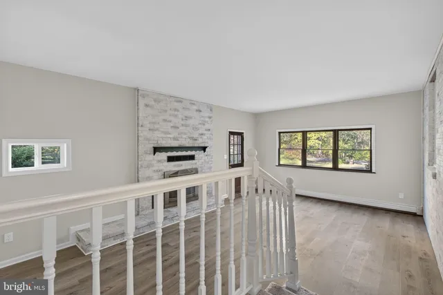 a view of an empty room with a fireplace