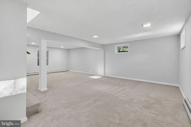 a view of an empty room with a chair