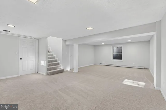 a view of a house with a yard patio and swimming pool