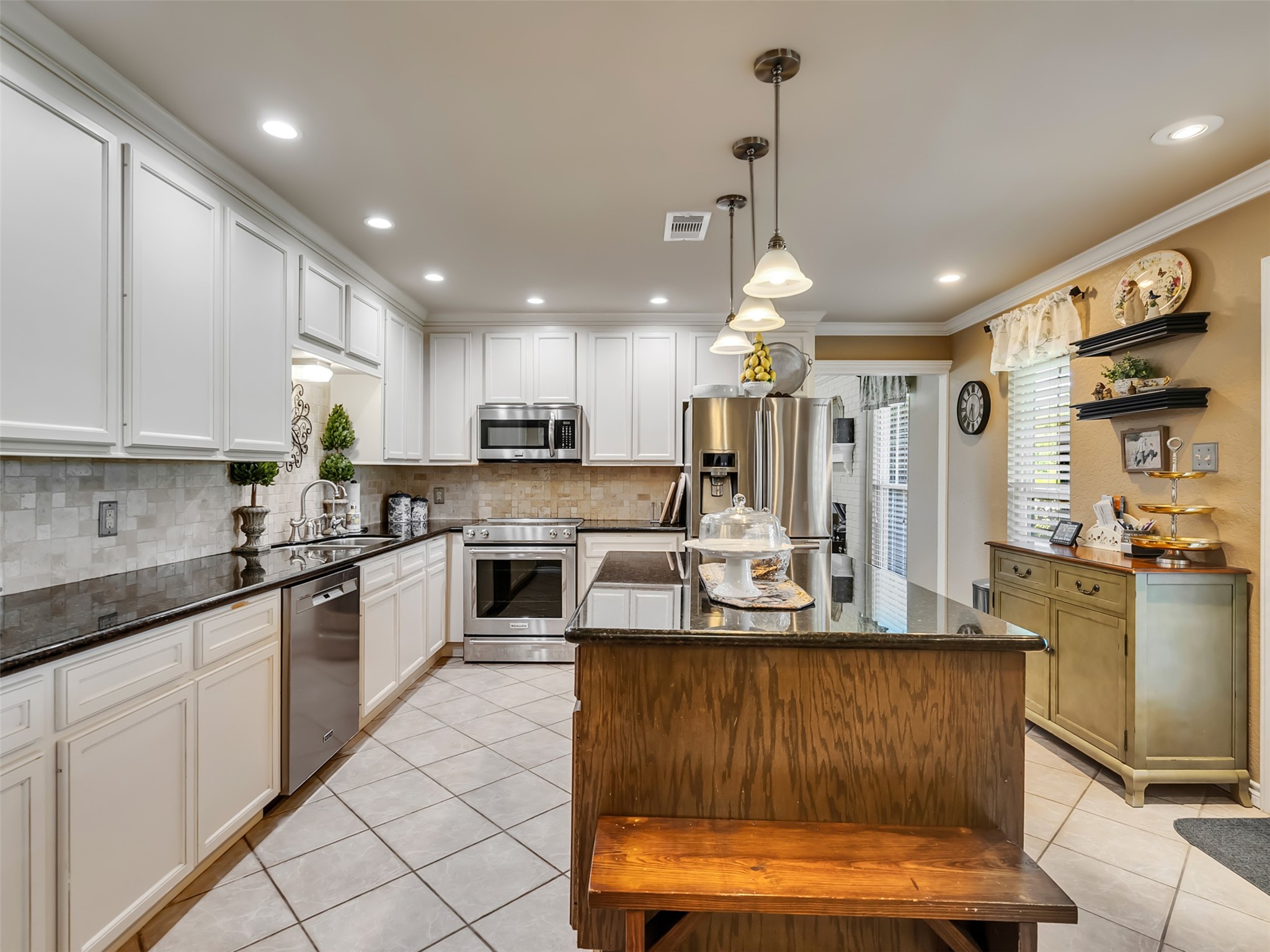 7202 Wetzel Road Dickinson, TX 77539 - Photo 21 of 46 This spacious kitchen is made for creating memories, offering generous counter space, abundant cabinetry, and a functional layout that's perfect for preparing holiday feasts and gathering with loved ones.