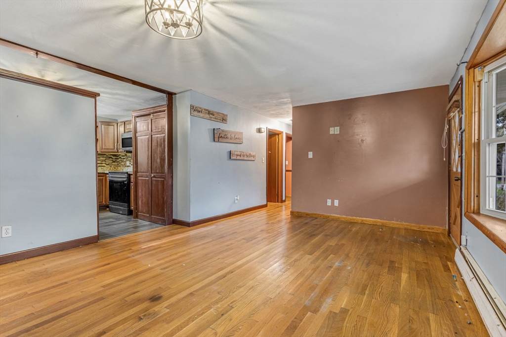 21 Annette Road Brockton, MA 02302 - Photo 11 of 29 a view of an empty room with wooden floor and a window
