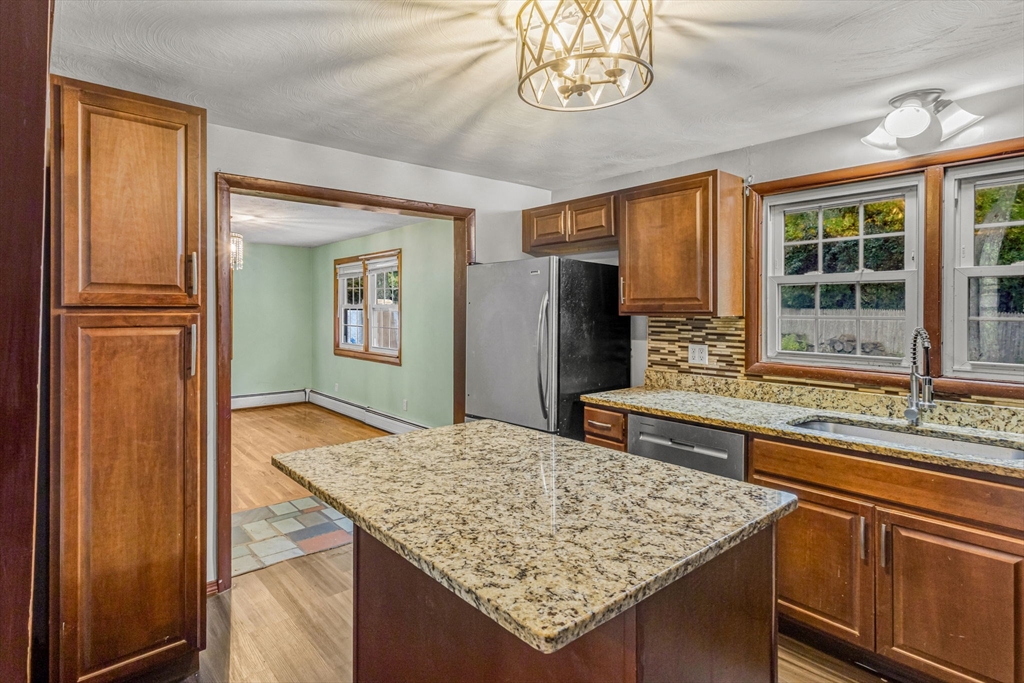 21 Annette Road Brockton, MA 02302 - Photo 13 of 29 a kitchen with stainless steel appliances granite countertop a sink refrigerator and cabinets