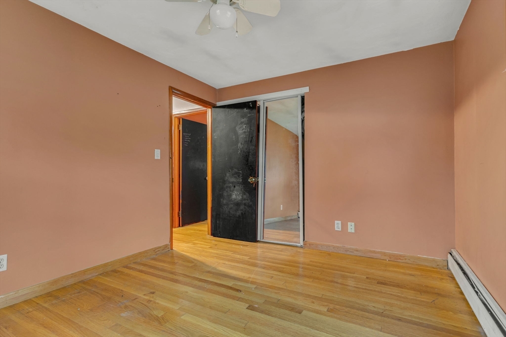 21 Annette Road Brockton, MA 02302 - Photo 21 of 29 a view of an empty room with wooden floor and a ceiling fan