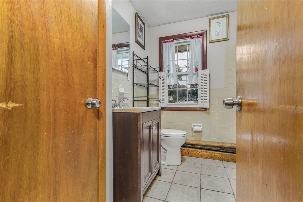 21 Annette Road Brockton, MA 02302 - Photo 24 of 29 a bathroom with a granite countertop sink toilet and shower