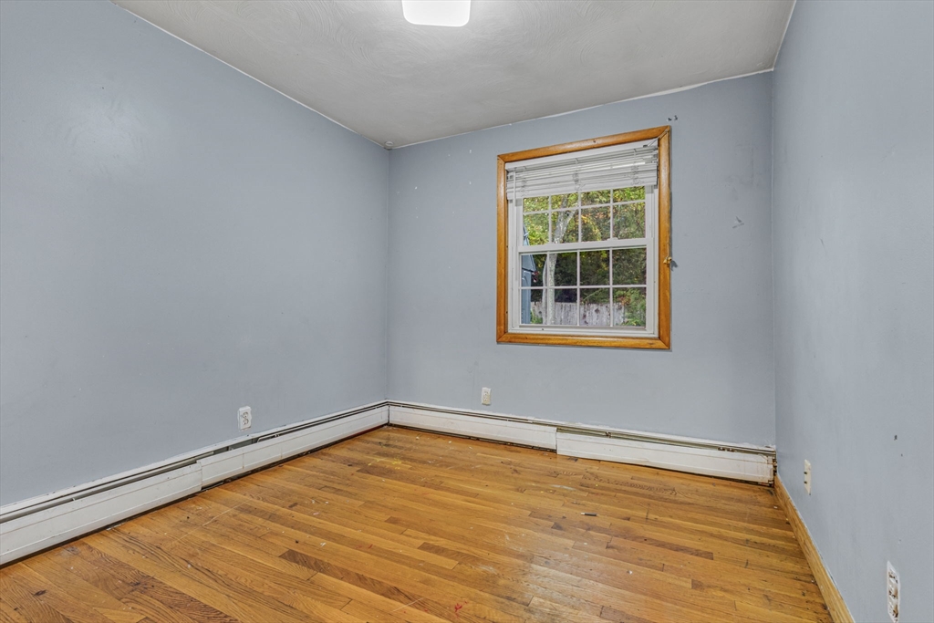 21 Annette Road Brockton, MA 02302 - Photo 26 of 29 a view of empty room with wooden floor and fan