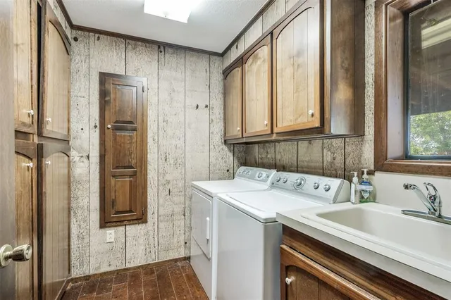 a utility room with a window dryer and washer
