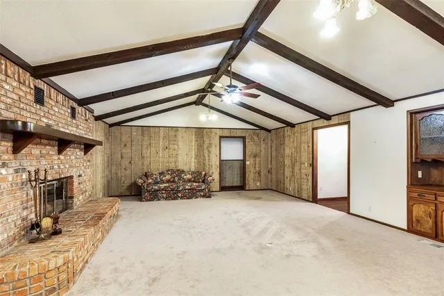 a view of a livingroom with furniture and chandelier