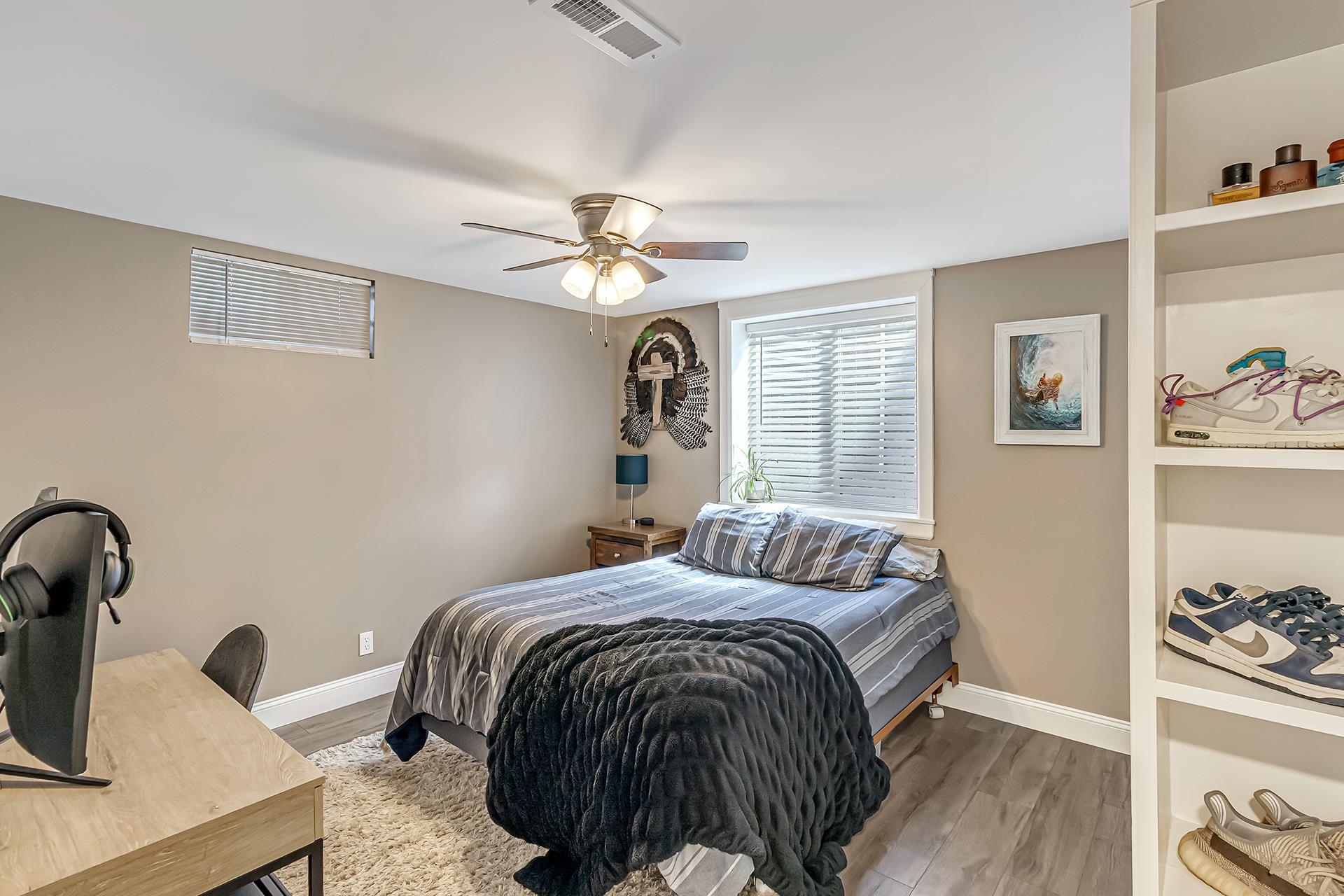 2118 Saguaro Road Grand Junction, CO 81507 - Photo 22 of 42 a bedroom with a bed and a chandelier