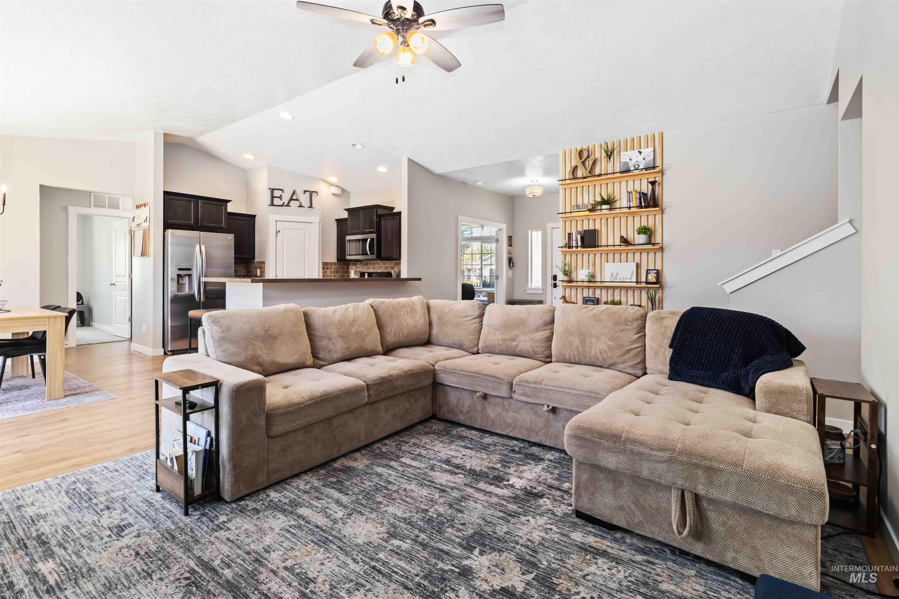 588 Gateway Avenue Middleton, ID 83644 - Photo 13 of 42 Living area featuring a ceiling fan, lofted ceiling, wood finished floors, and recessed lighting