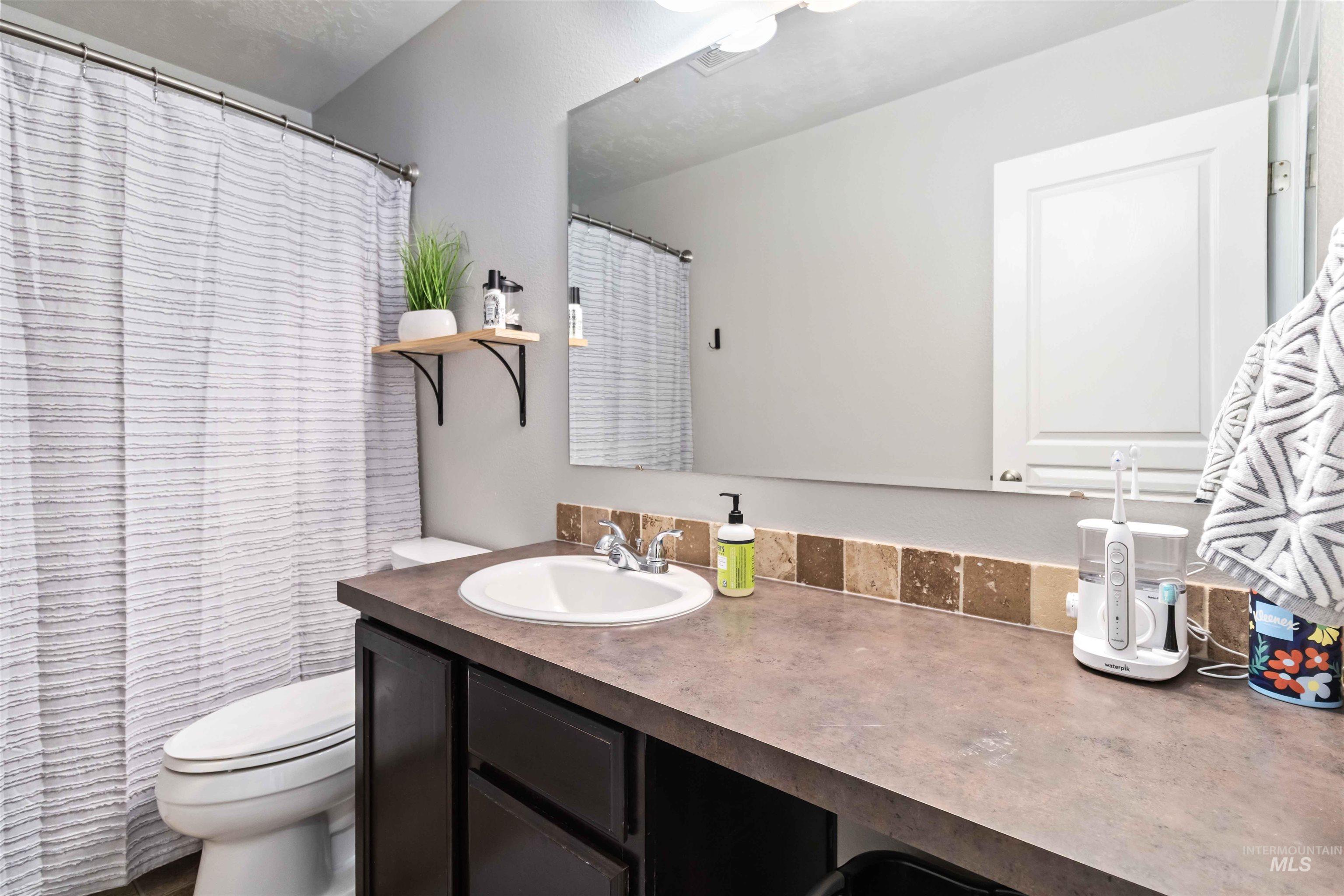 588 Gateway Avenue Middleton, ID 83644 - Photo 25 of 42 Bathroom featuring vanity and a shower with curtain