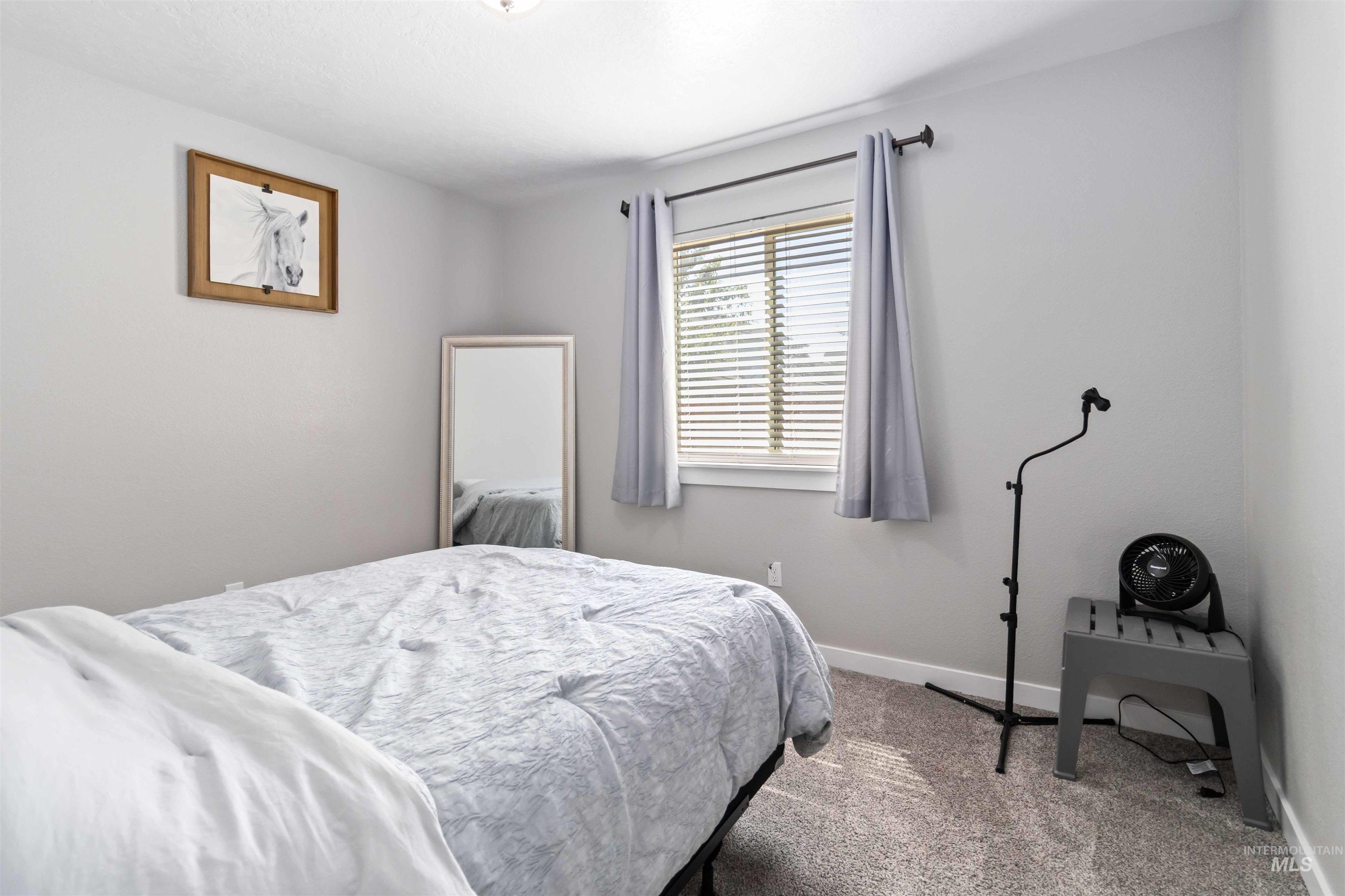 588 Gateway Avenue Middleton, ID 83644 - Photo 26 of 42 Bedroom featuring baseboards and carpet flooring