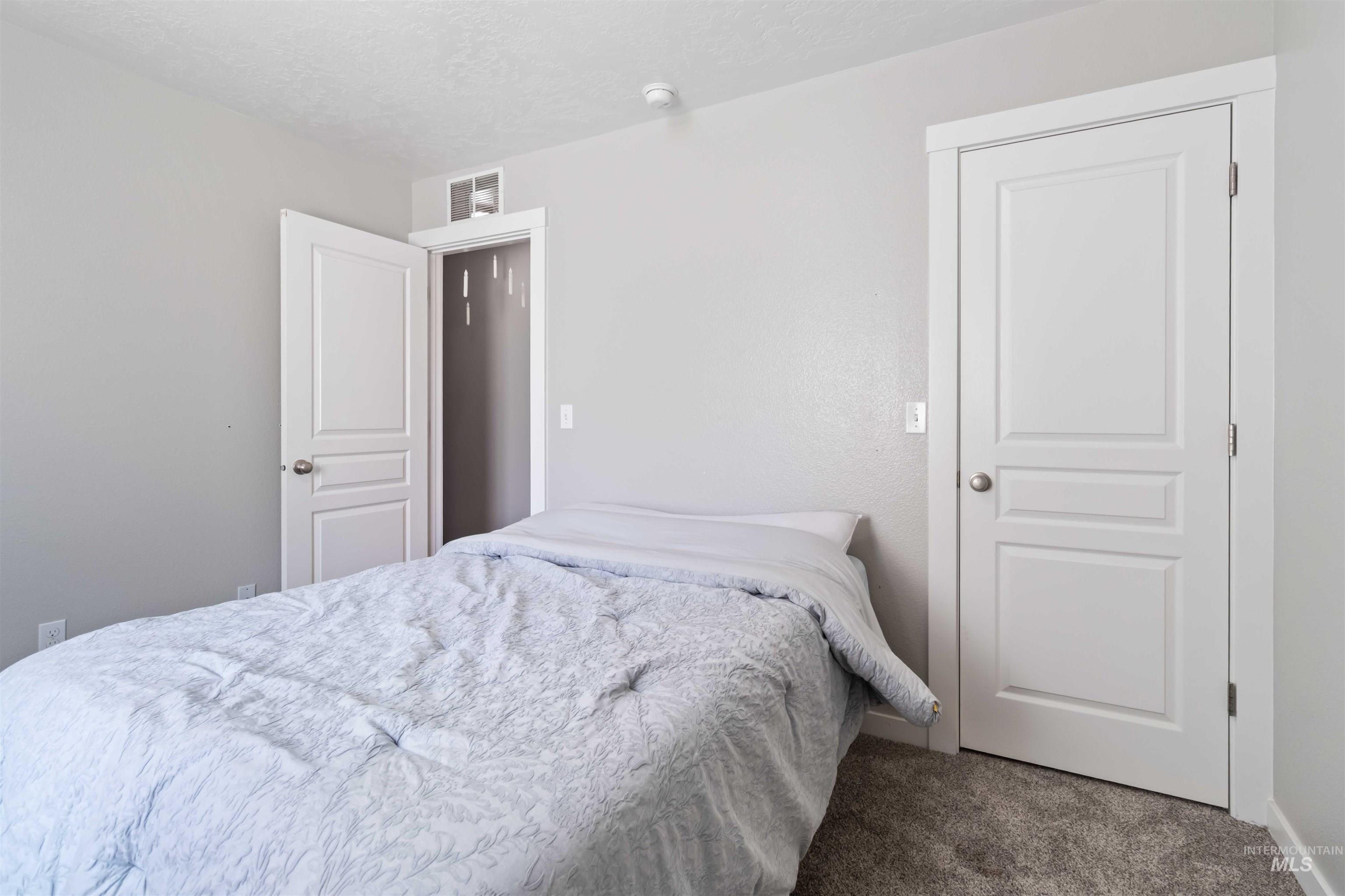 588 Gateway Avenue Middleton, ID 83644 - Photo 27 of 42 Bedroom featuring carpet floors and a textured ceiling