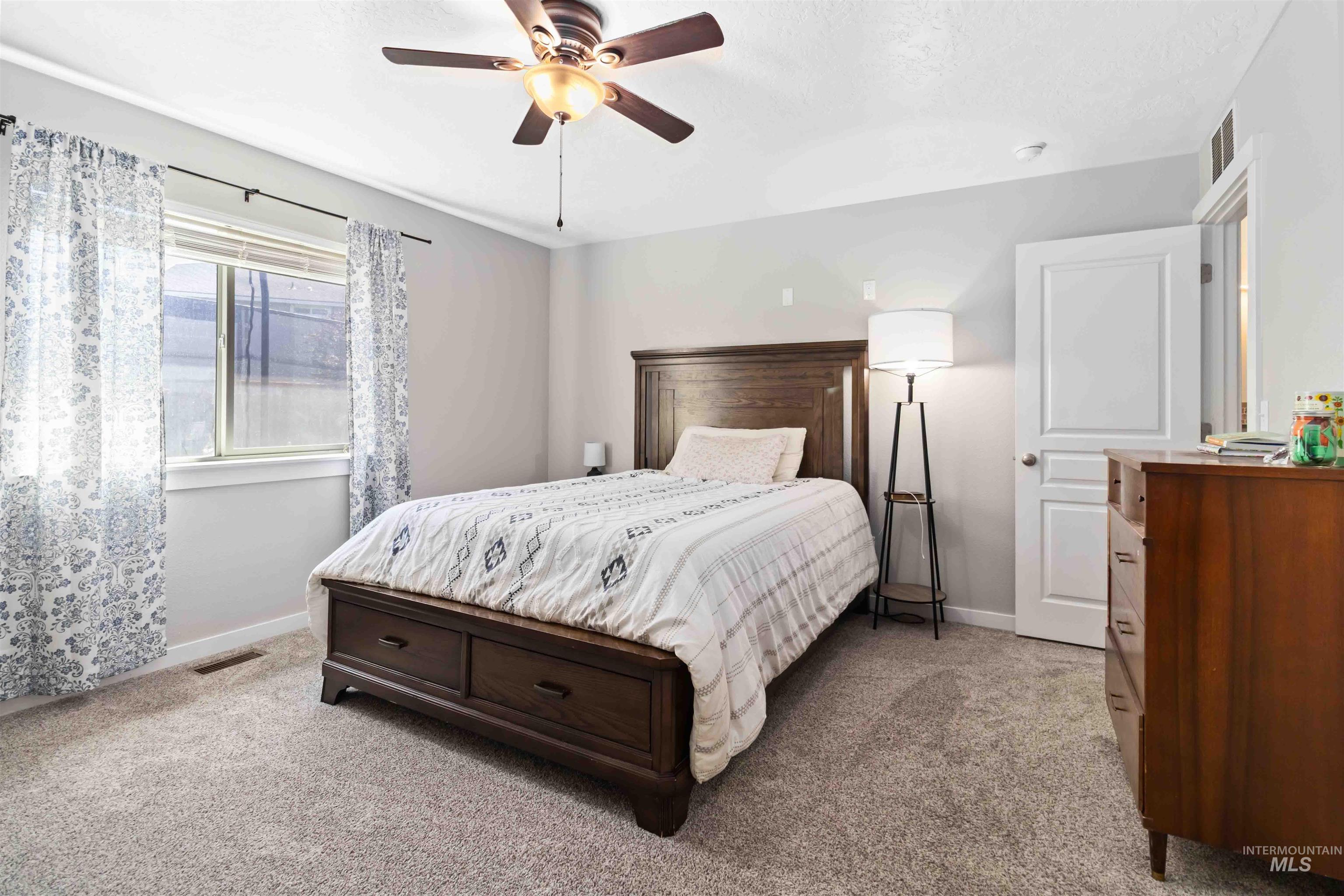 588 Gateway Avenue Middleton, ID 83644 - Photo 29 of 42 Carpeted bedroom featuring baseboards and a ceiling fan