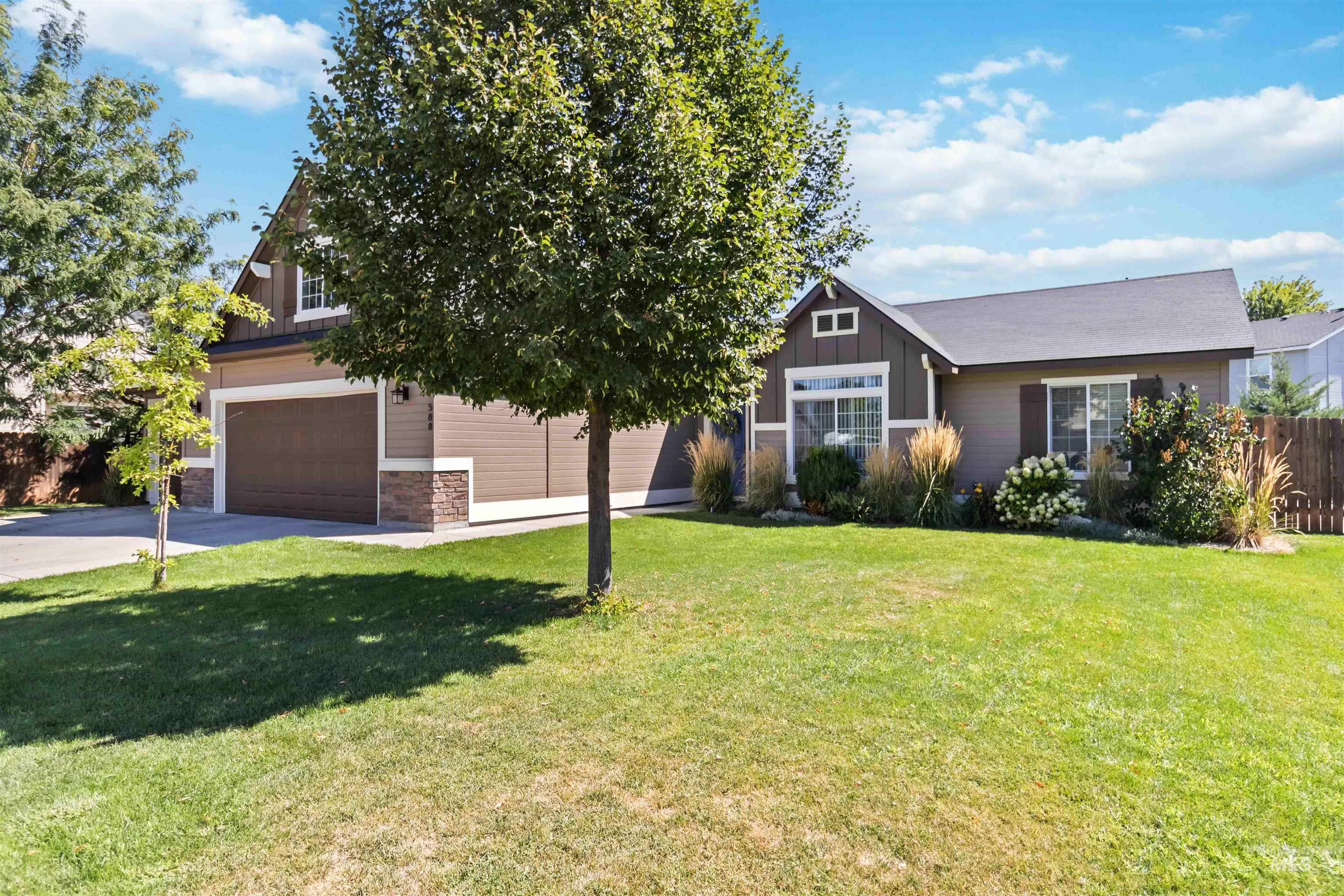 588 Gateway Avenue Middleton, ID 83644 - Photo 3 of 42 View of front of house with board and batten siding, stone siding, and driveway