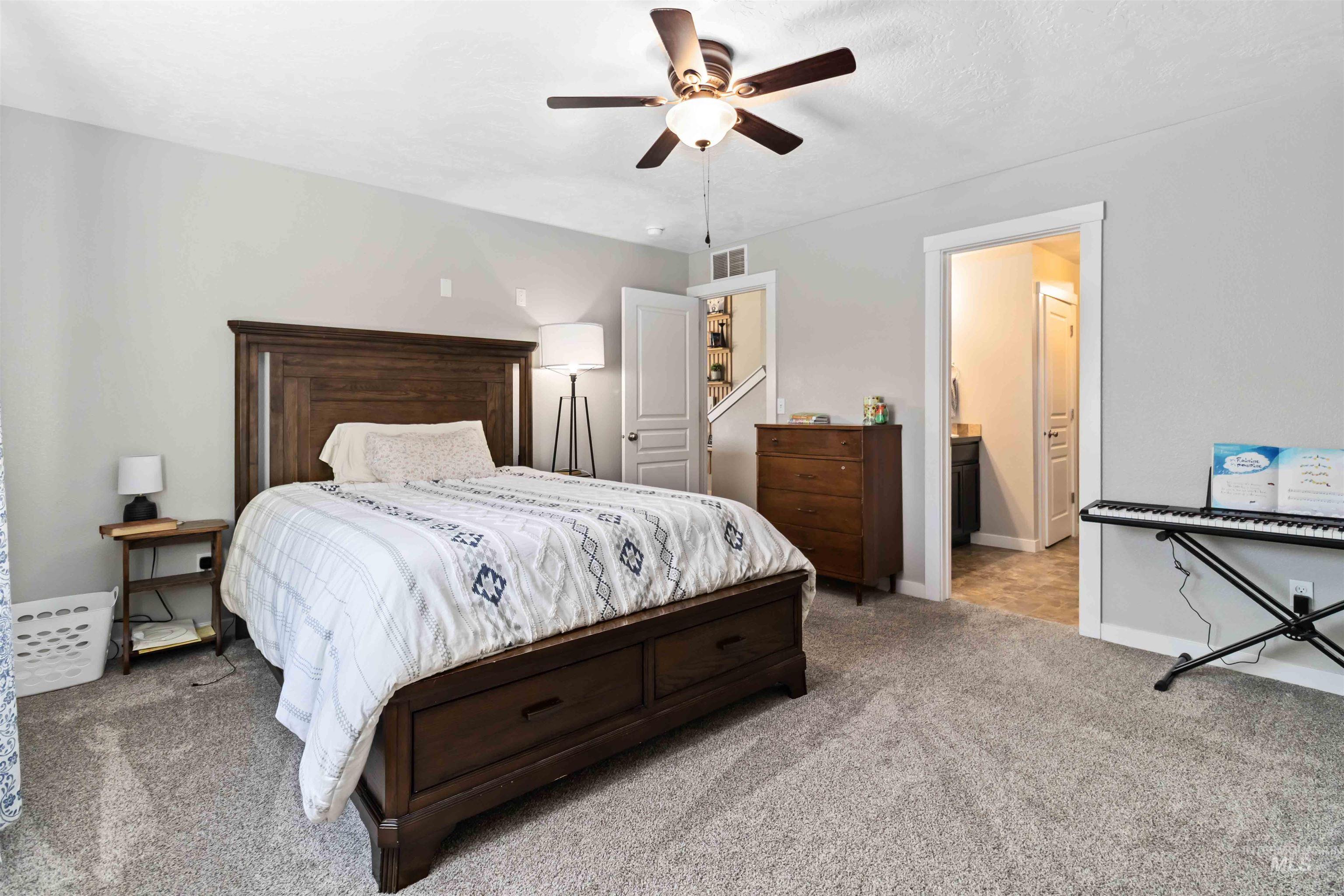 588 Gateway Avenue Middleton, ID 83644 - Photo 31 of 42 Carpeted bedroom with ceiling fan and connected bathroom