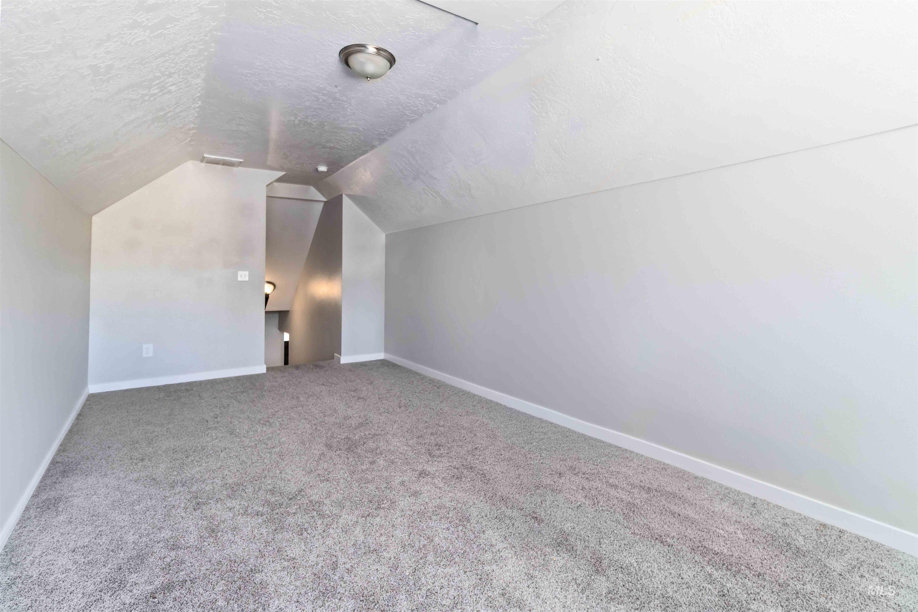 588 Gateway Avenue Middleton, ID 83644 - Photo 35 of 42 Additional living space featuring baseboards and carpet