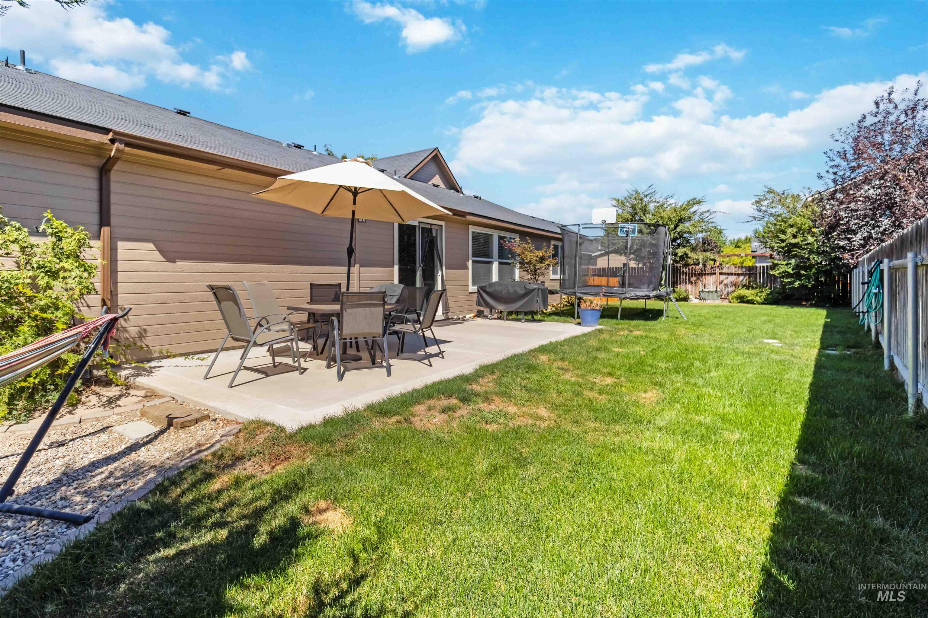 588 Gateway Avenue Middleton, ID 83644 - Photo 36 of 42 Fenced backyard featuring a trampoline and a patio area