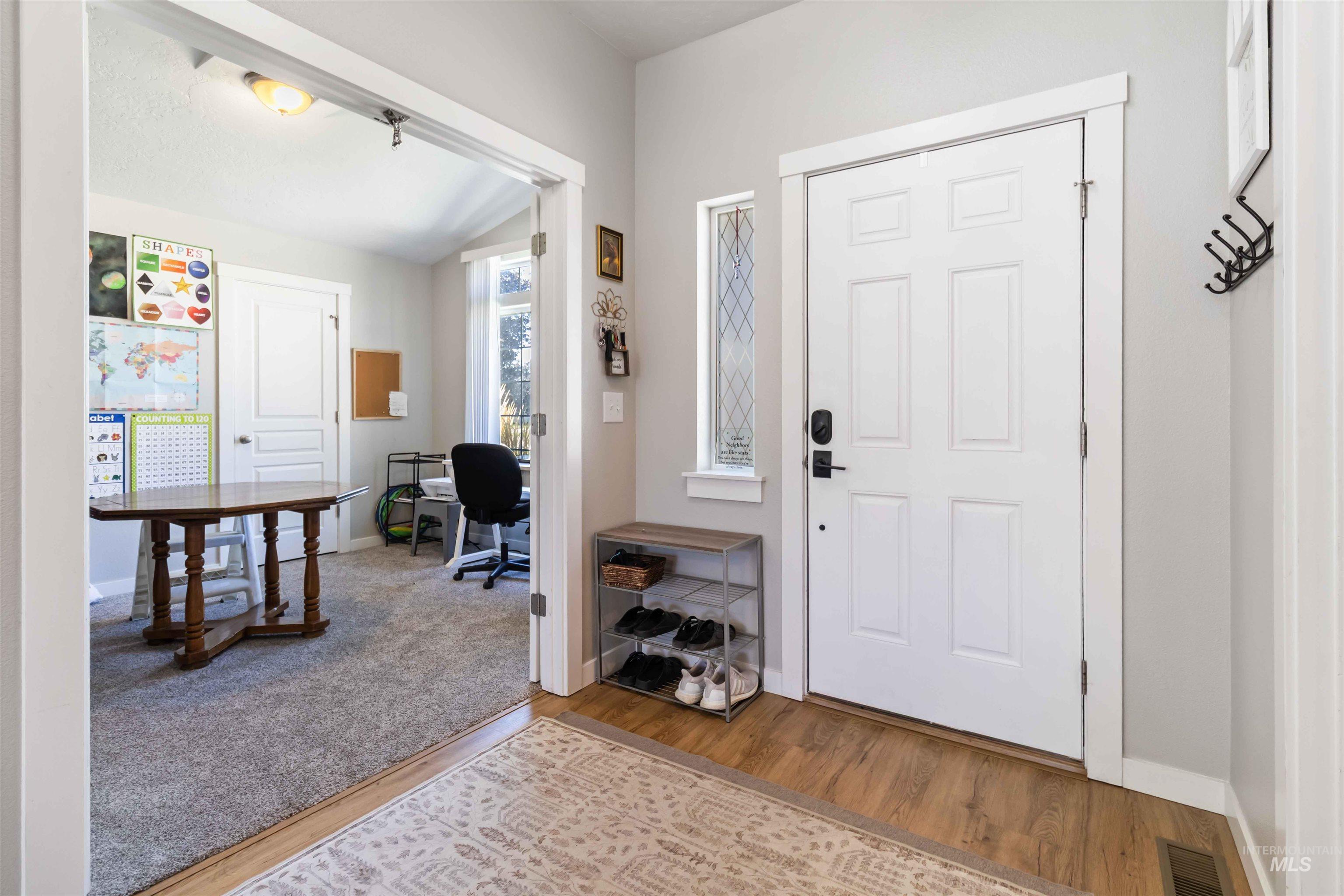 588 Gateway Avenue Middleton, ID 83644 - Photo 6 of 42 Entryway with light wood finished floors and vaulted ceiling
