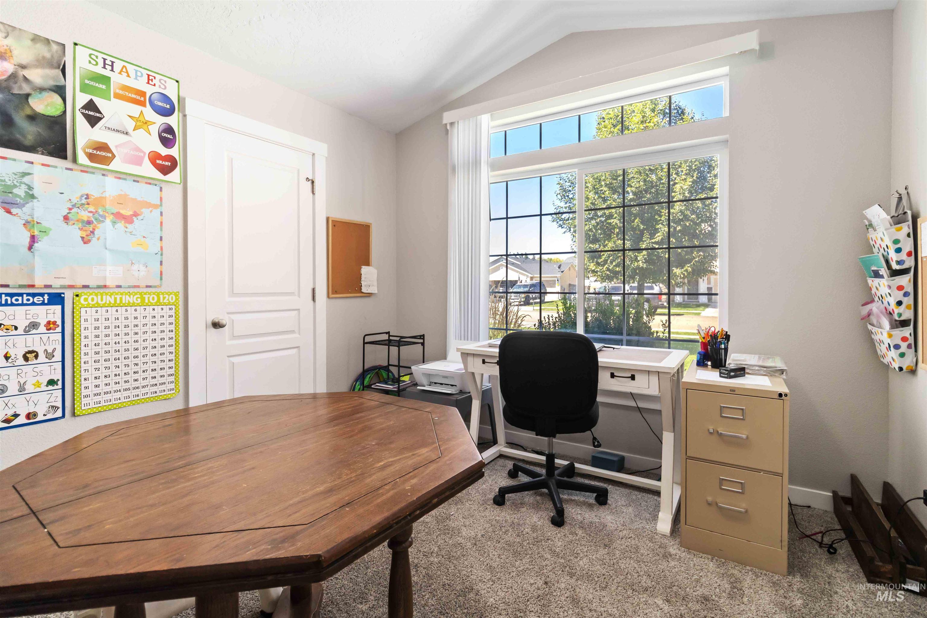 588 Gateway Avenue Middleton, ID 83644 - Photo 8 of 42 Carpeted office space featuring vaulted ceiling and baseboards