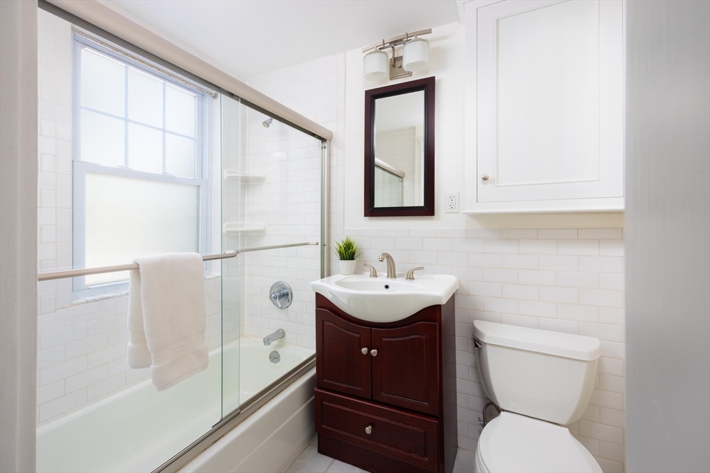 38 Garrison Road, Unit 2 Brookline, MA 02445 - Photo 10 of 18 a bathroom with a sink a toilet and shower