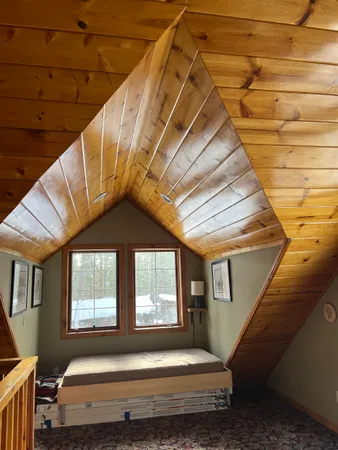 a view of balcony with a sink and wooden floors