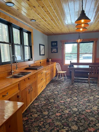 a spacious bathroom with double vanity and a large mirror