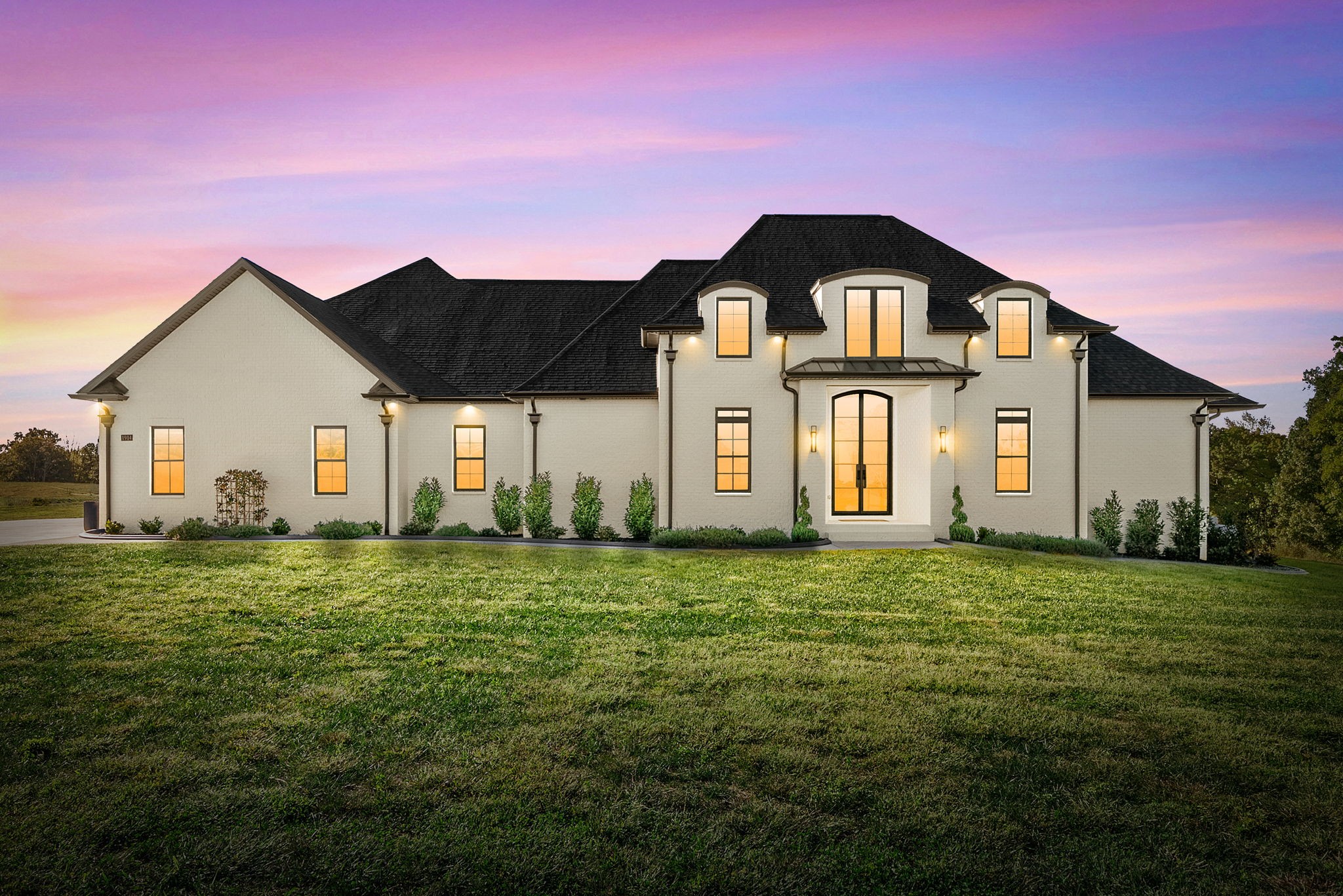 a front view of a house with a yard
