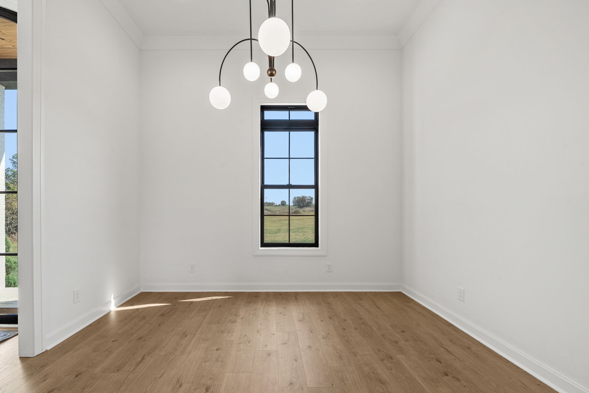 1914 Hickory Point Road Clarksville, TN 37043 - Photo 12 of 38 an empty room with wooden floor and windows