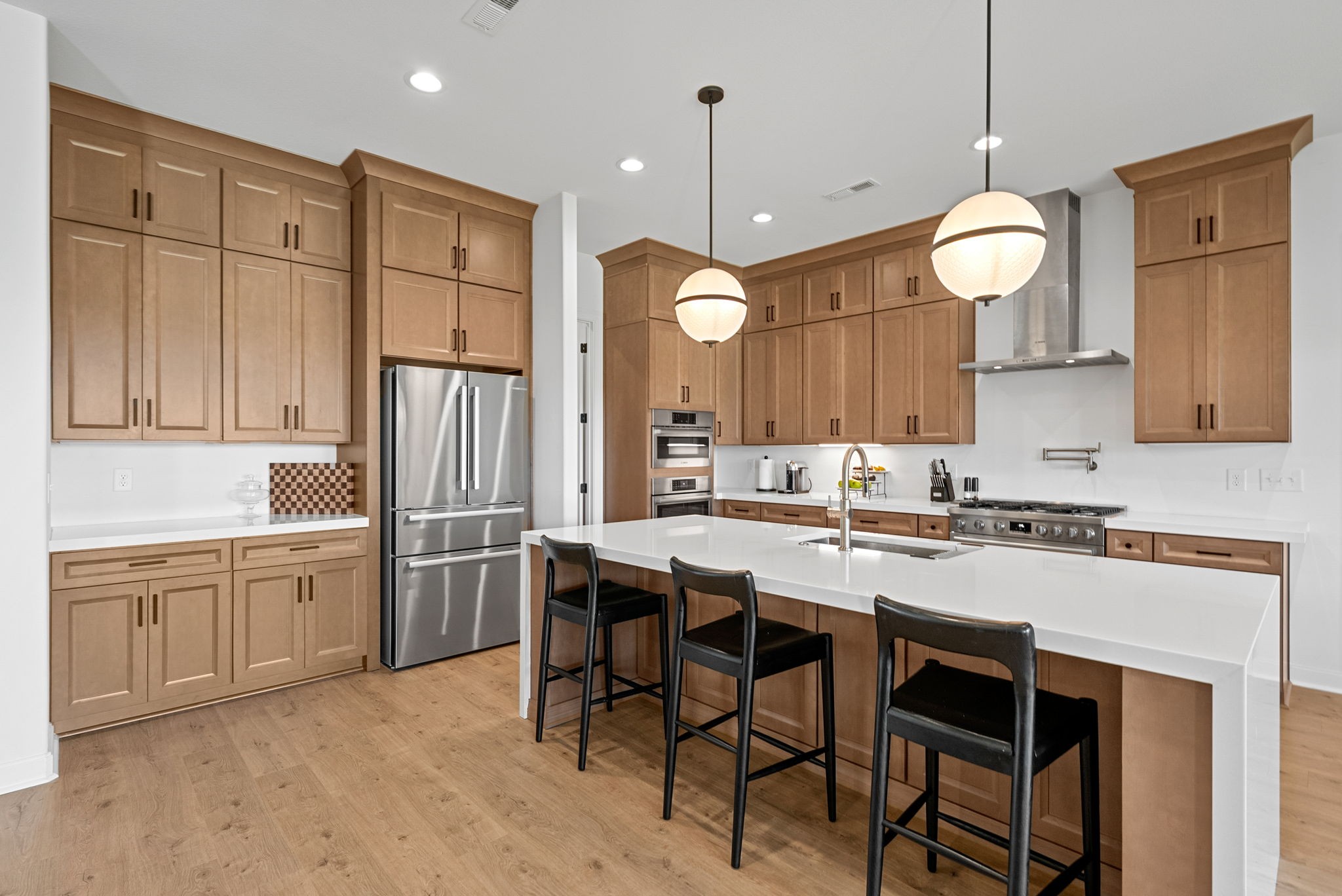 1914 Hickory Point Road Clarksville, TN 37043 - Photo 14 of 38 a kitchen with cabinets a center island a stove and a chandelier
