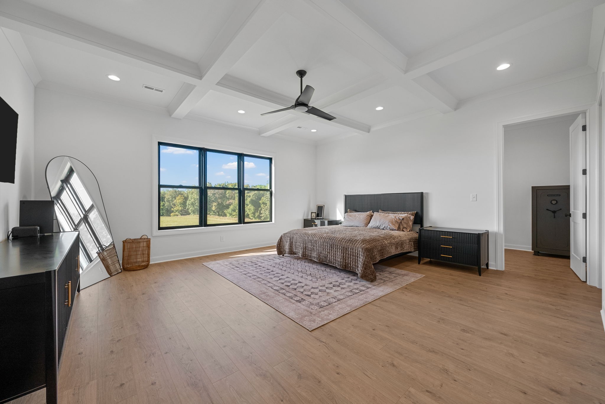 1914 Hickory Point Road Clarksville, TN 37043 - Photo 20 of 38 a spacious bedroom with a large bed and a chandelier