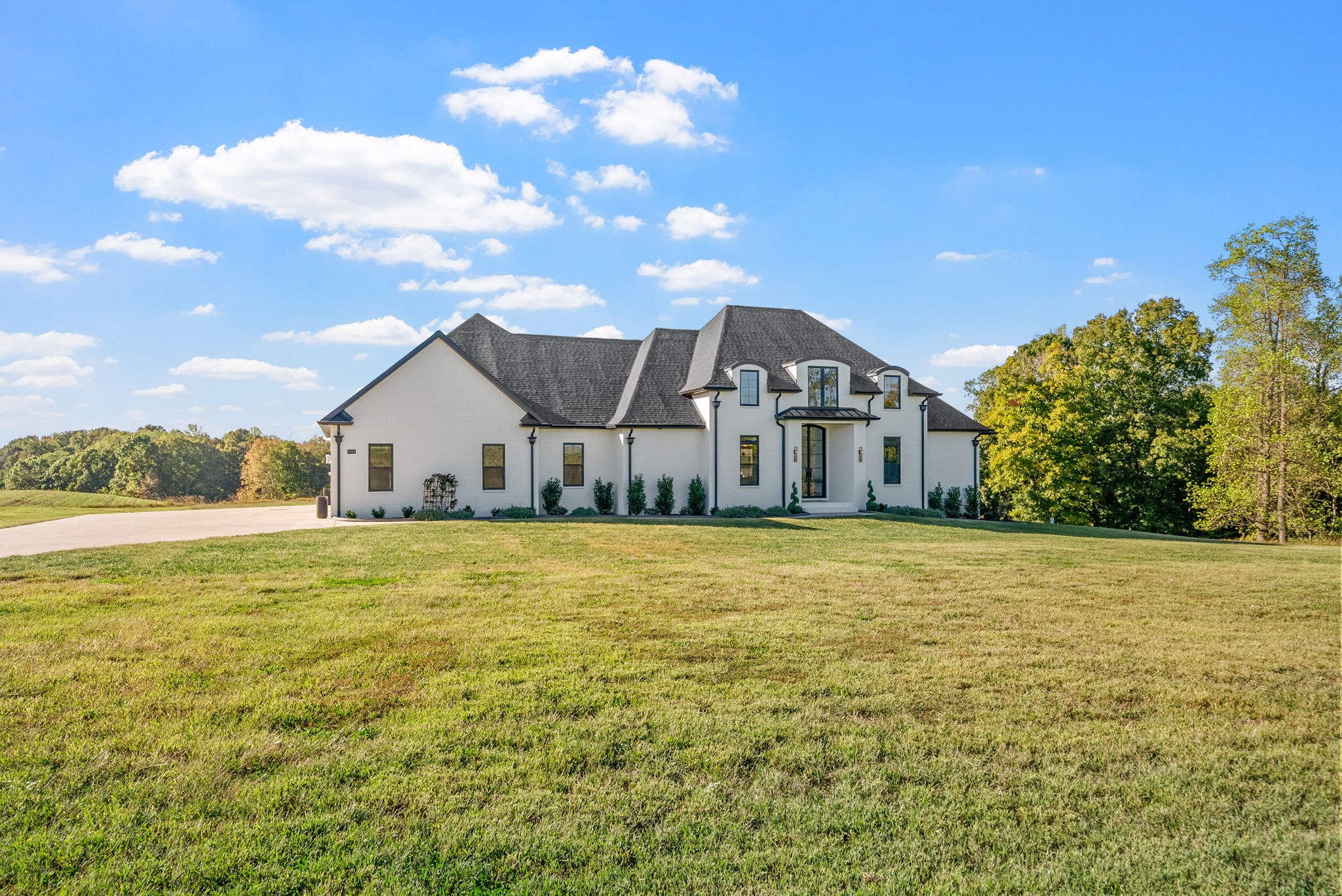 1914 Hickory Point Road Clarksville, TN 37043 - Photo 8 of 38 a view of a large house with a big yard and large trees