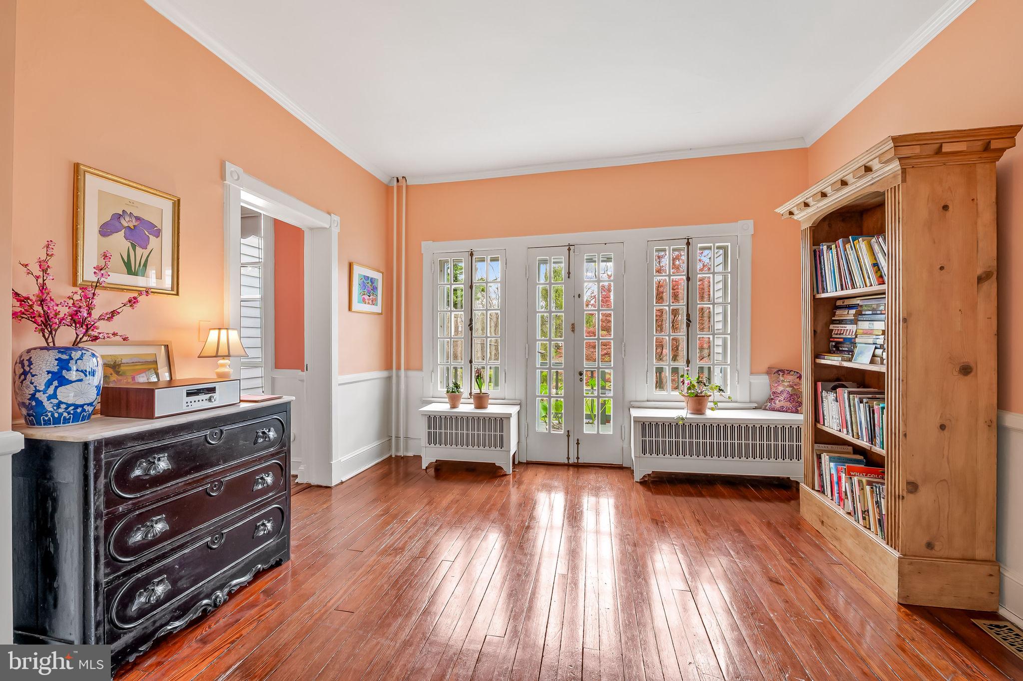 1018 Windsor Road Baltimore, MD 21208 - Photo 11 of 50 a room with furniture and a floor to ceiling window