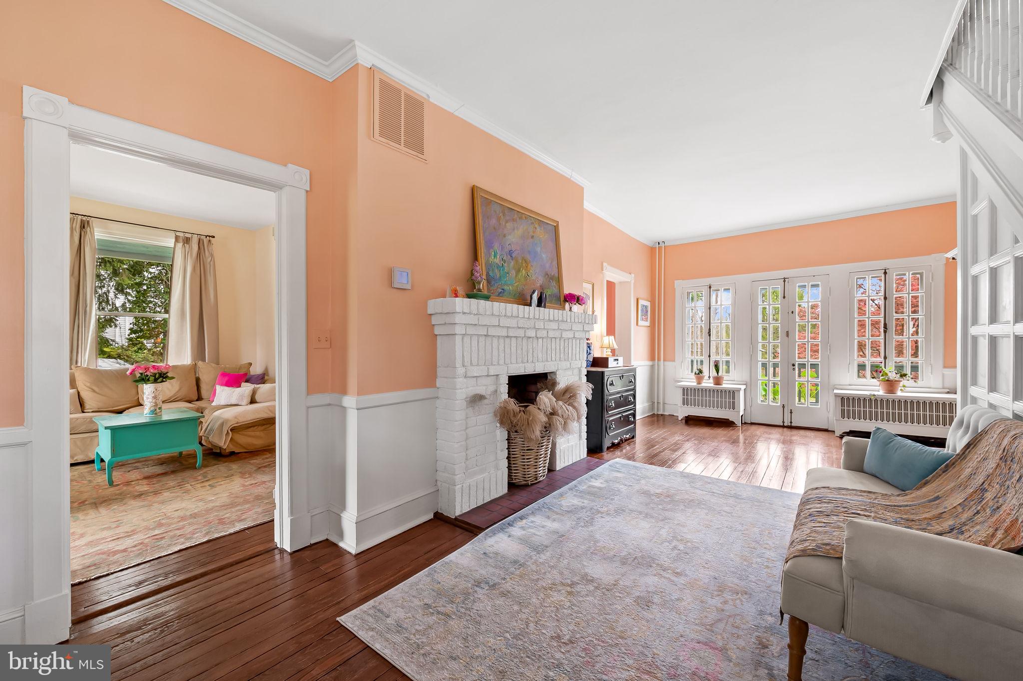 1018 Windsor Road Baltimore, MD 21208 - Photo 12 of 50 a living room with furniture and a fireplace