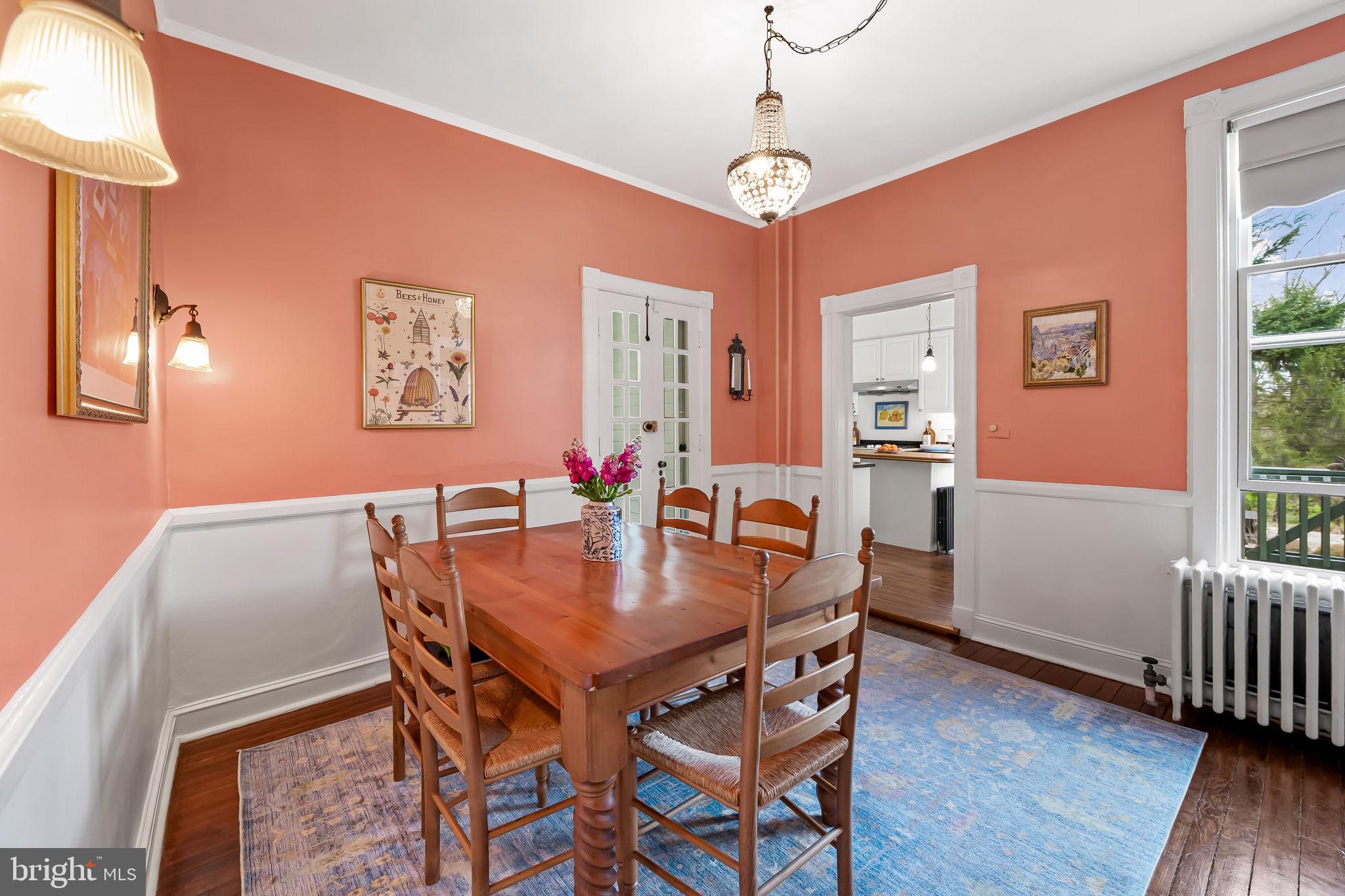 1018 Windsor Road Baltimore, MD 21208 - Photo 16 of 50 a view of a dining room with furniture and wooden floor