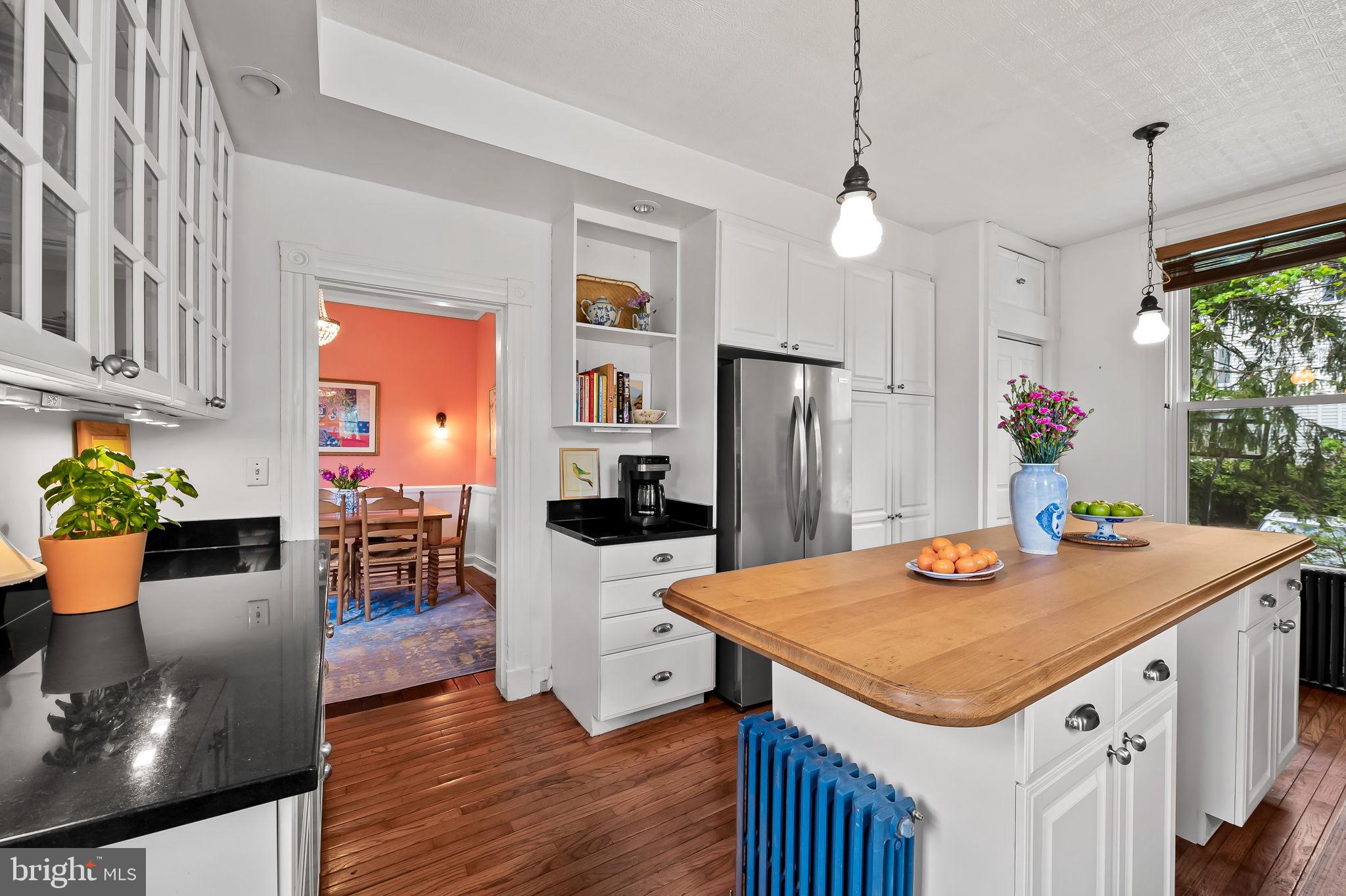1018 Windsor Road Baltimore, MD 21208 - Photo 21 of 50 a kitchen that has a table chairs and wooden floor