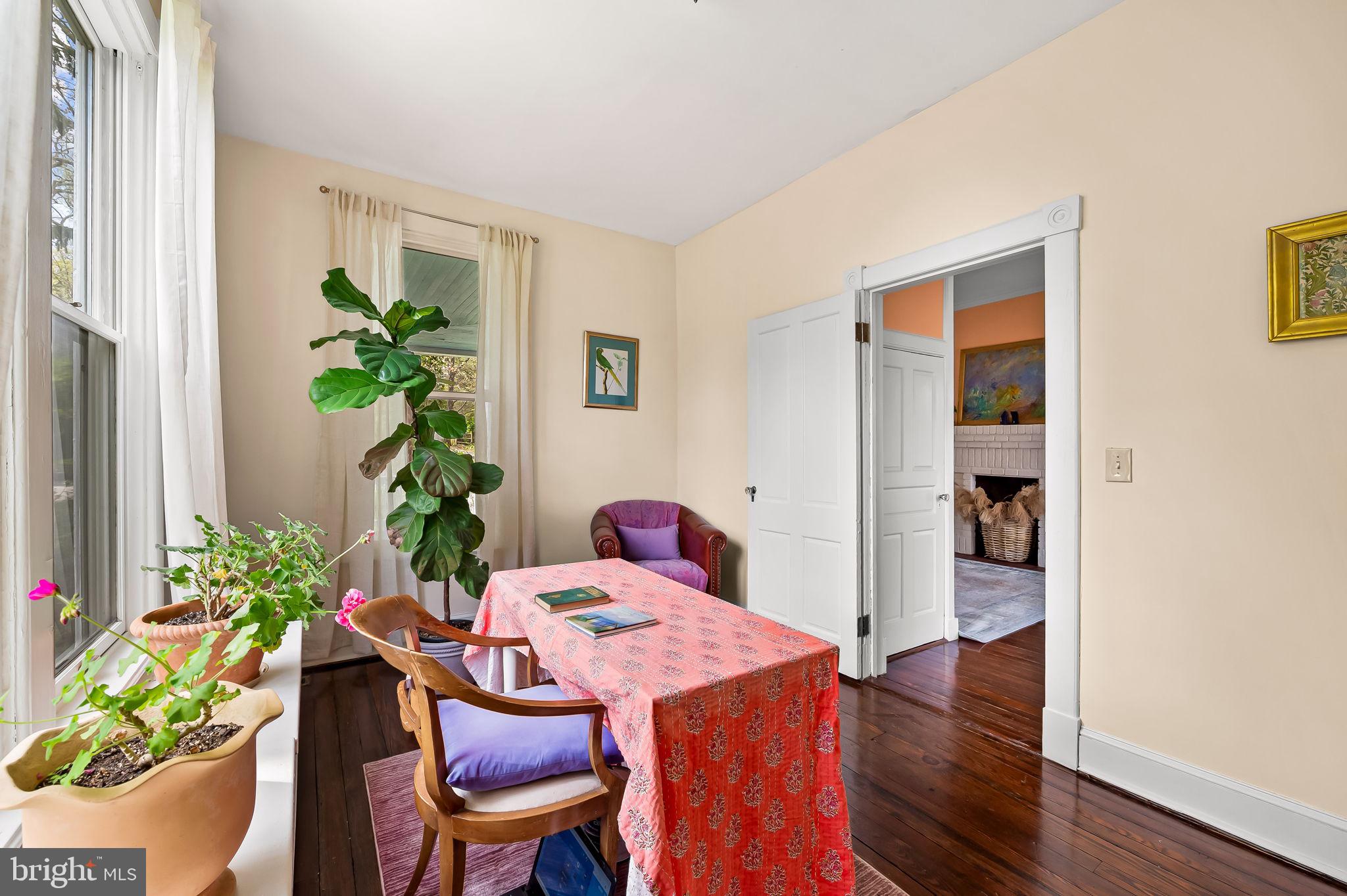 1018 Windsor Road Baltimore, MD 21208 - Photo 26 of 50 a dining room with furniture and wooden floor