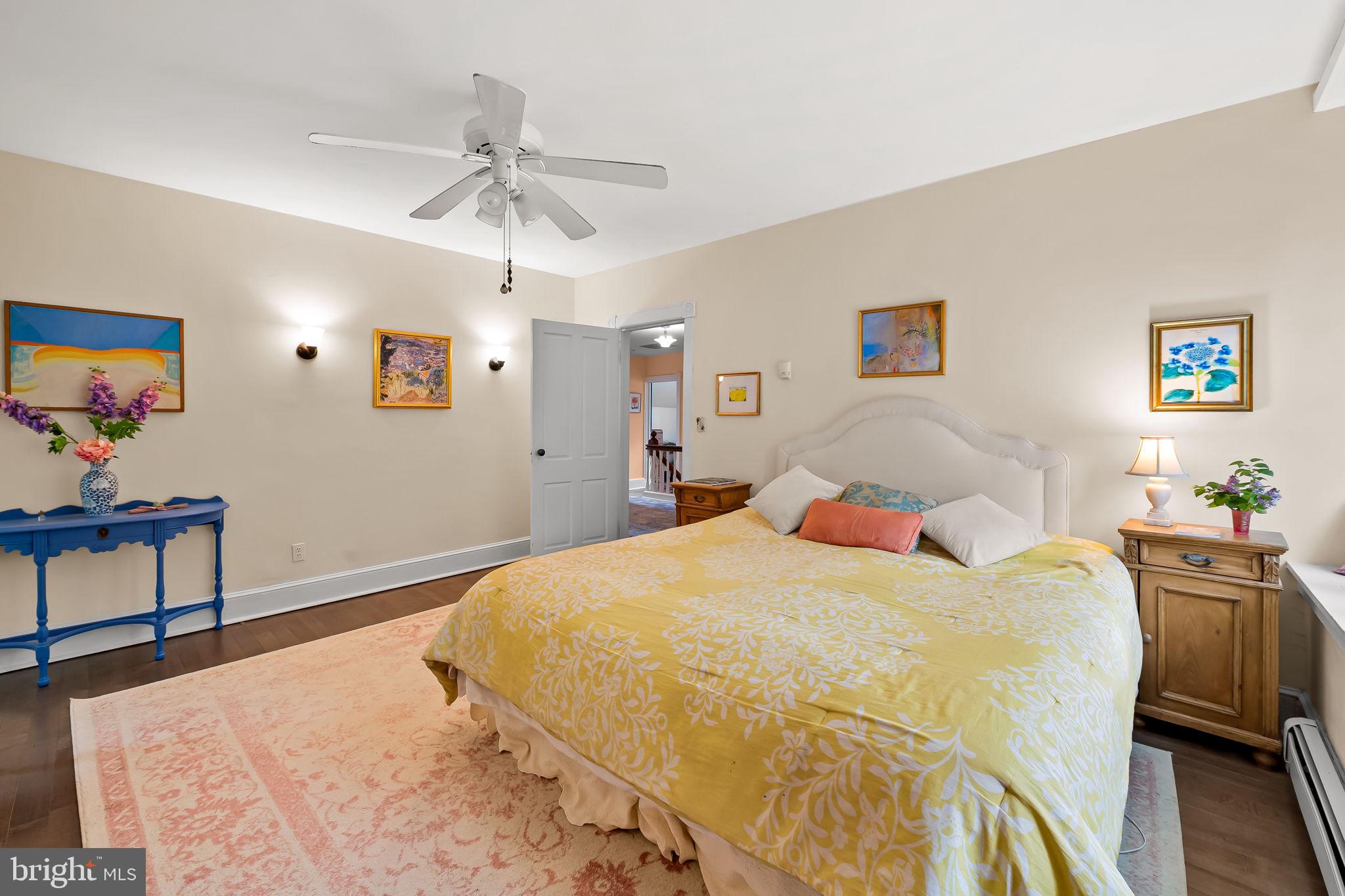 1018 Windsor Road Baltimore, MD 21208 - Photo 32 of 50 a bedroom with a bed and a chandelier
