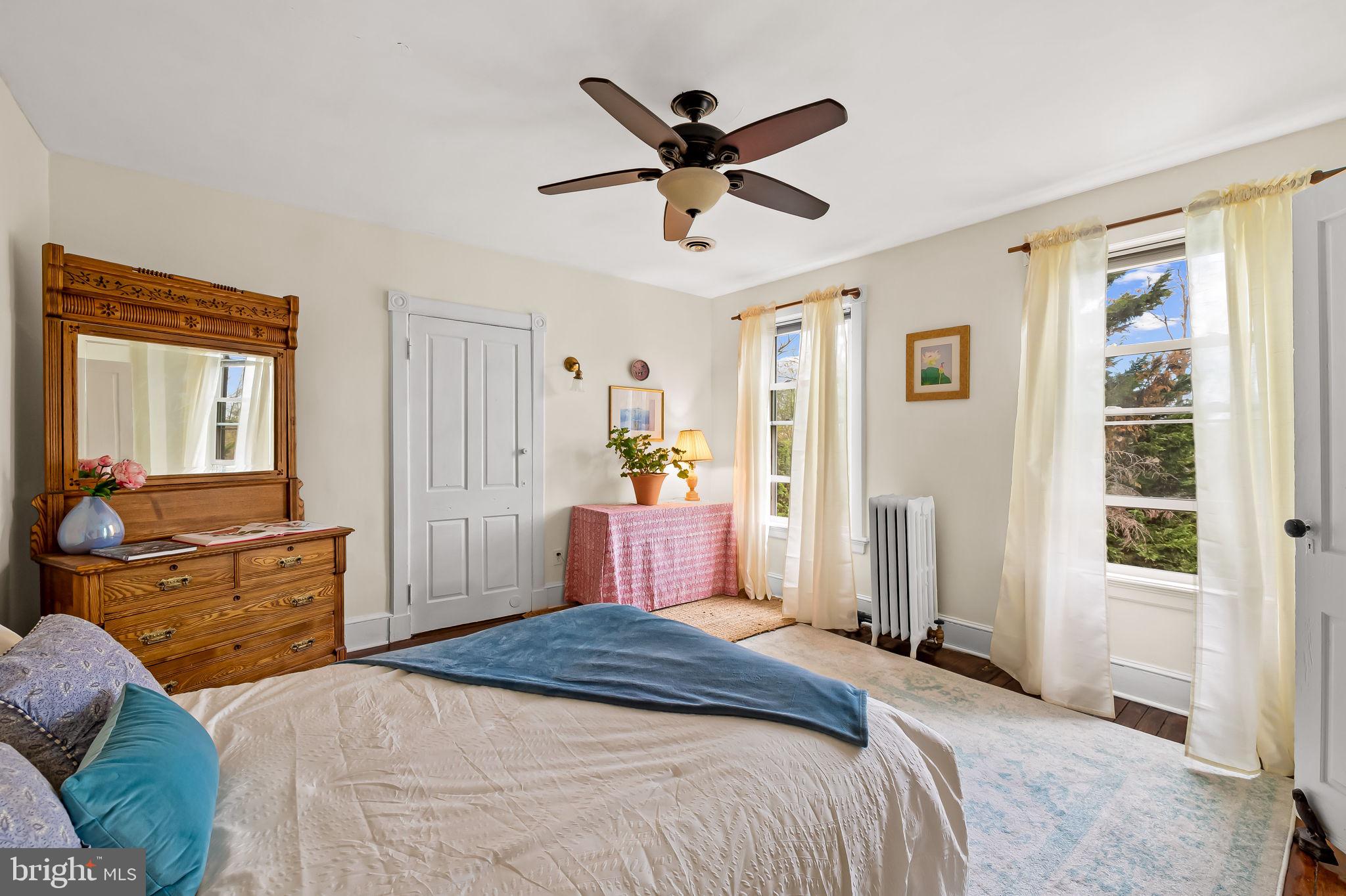 1018 Windsor Road Baltimore, MD 21208 - Photo 34 of 50 a bedroom with a bed and wooden floor