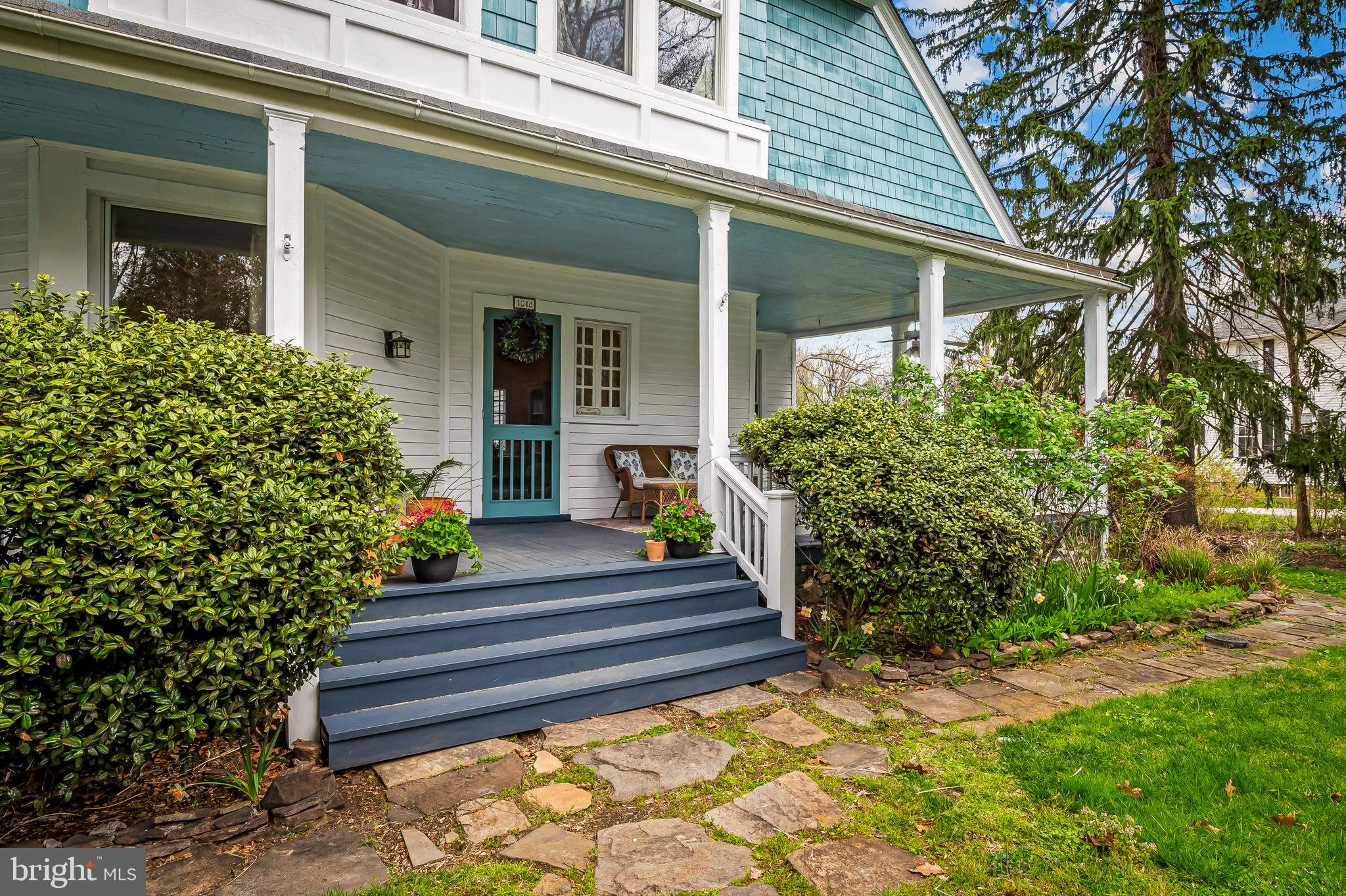 1018 Windsor Road Baltimore, MD 21208 - Photo 4 of 50 a view of a house with potted plants and a fountain