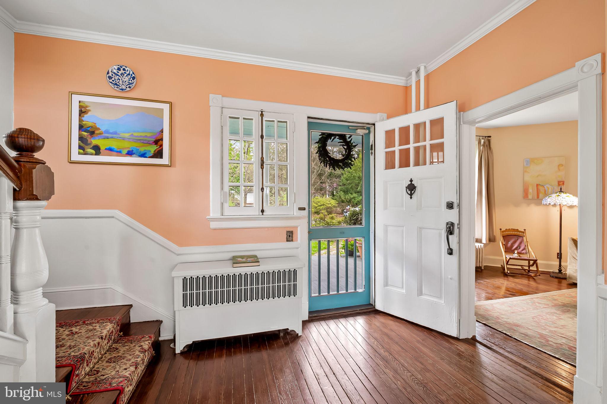 1018 Windsor Road Baltimore, MD 21208 - Photo 8 of 50 a view of a hallway with wooden floor and windows