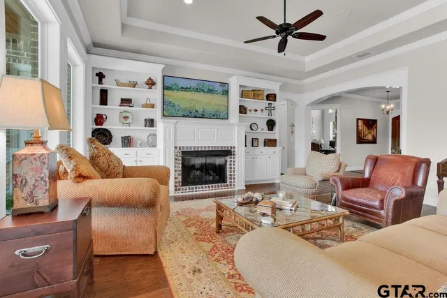 a living room with furniture and a fireplace
