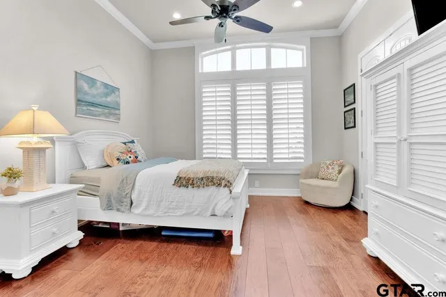 a bedroom with a bed and a couch